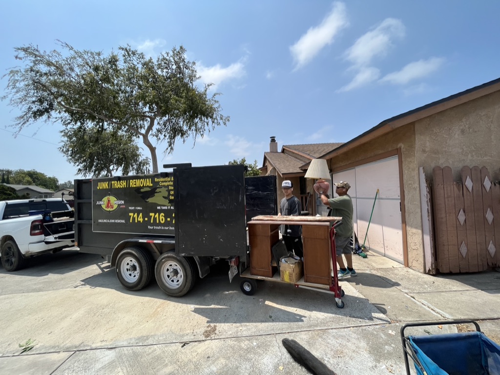 Junk Removal Workers Loading Junk in Dumpster in Santa Ana, CA