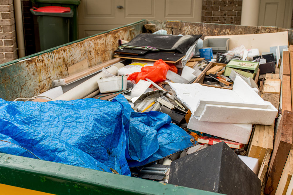 trash full of old garbage ready for Junk Removal Services in Santa Ana, CA